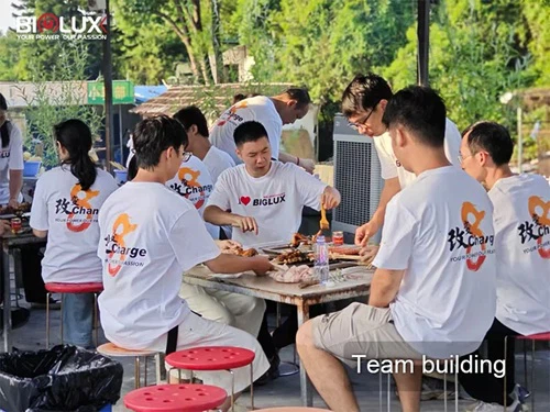 biglux team christmas celebration with mobile solar security camera towers in factory